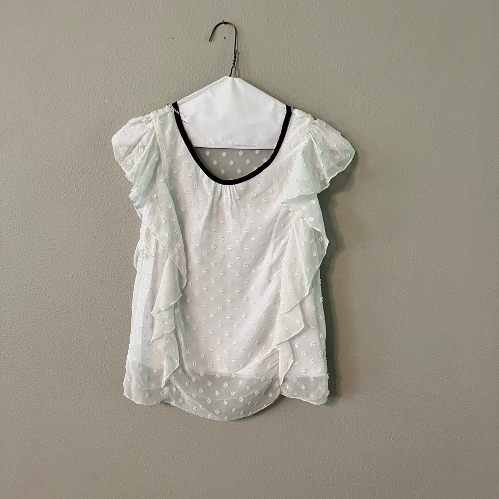 White ruffle blouse